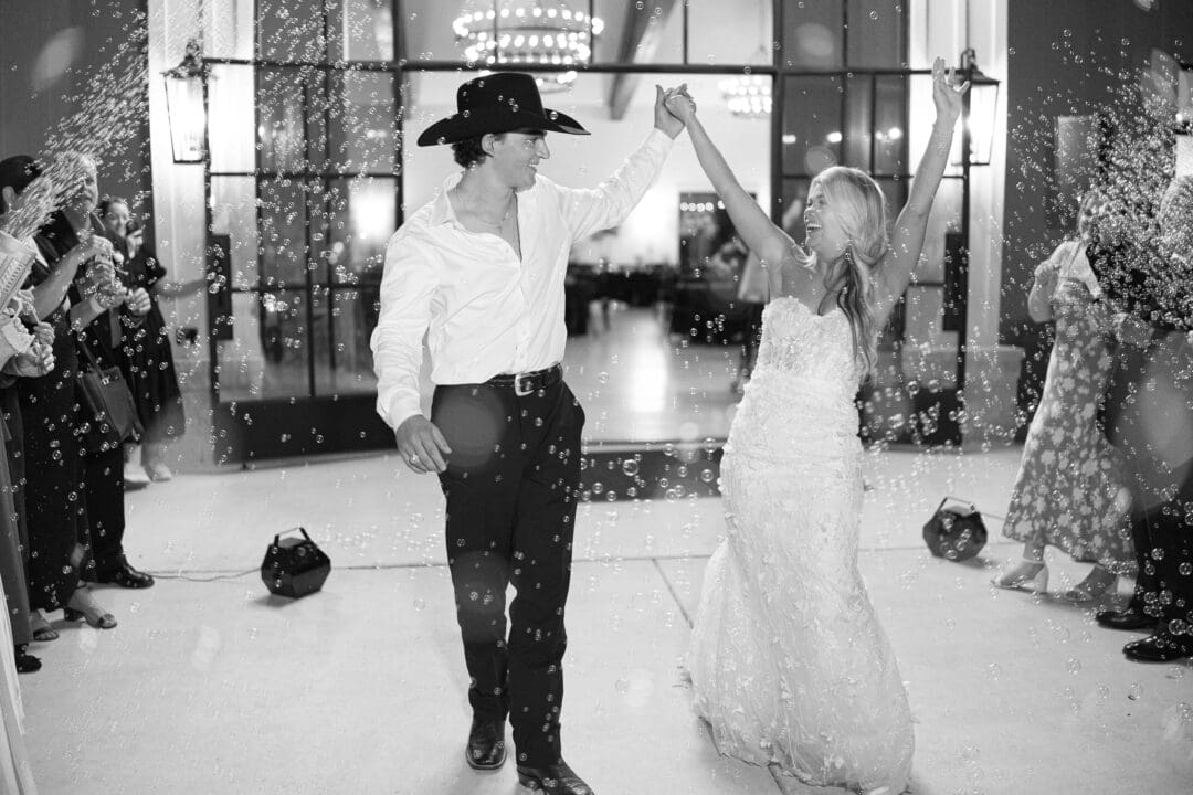 romantic bride and groom exit at Dos Palomas Ranch wedding photographed by Diana Brewer