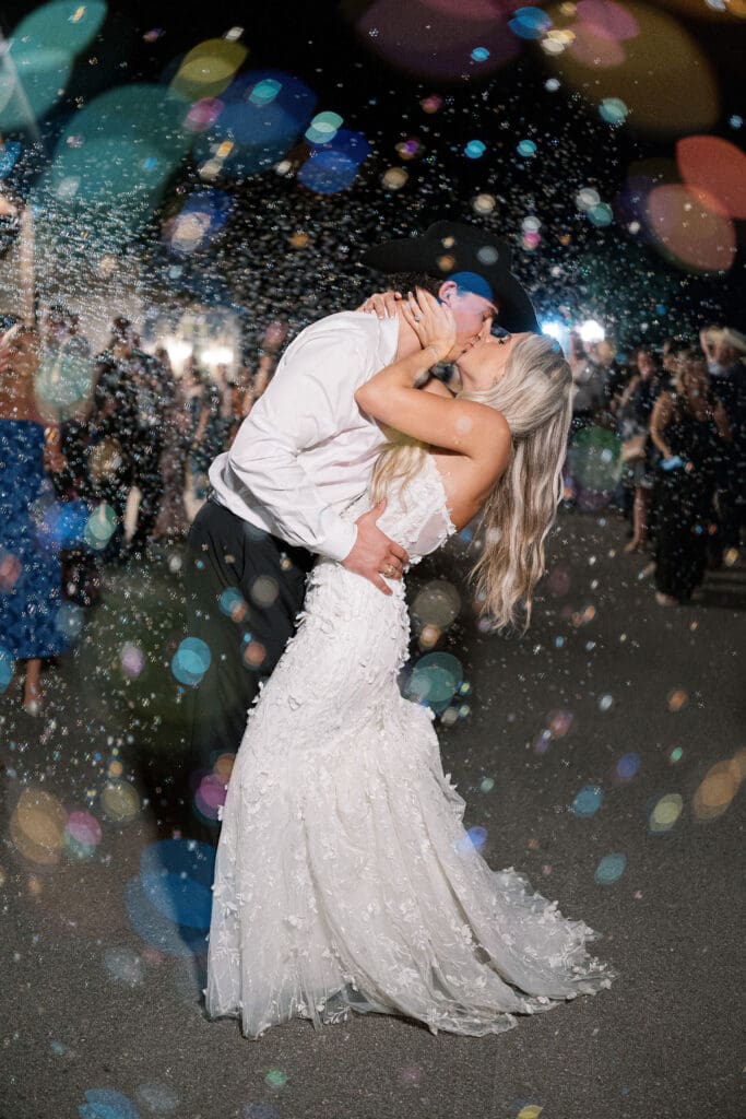 romantic bride and groom exit at Dos Palomas Ranch wedding photographed by Diana Brewer