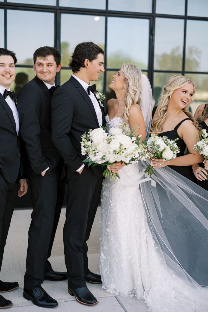 Candid laughter during wedding party photos at Dos Palomas Ranch