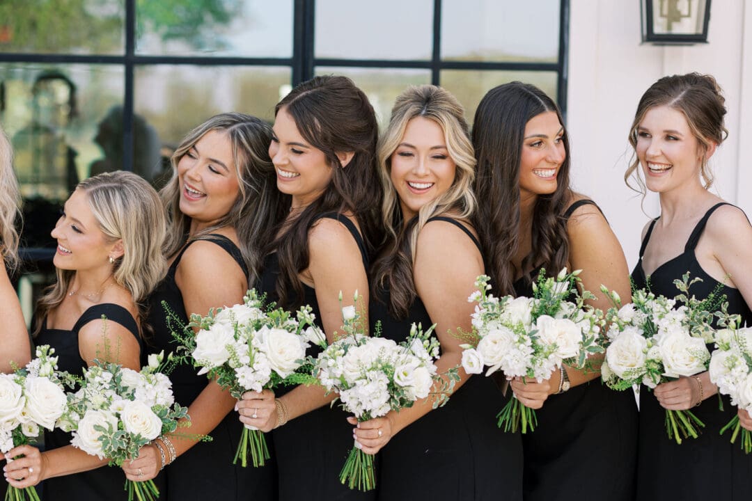 Candid laughter during wedding party photos at Dos Palomas Ranch