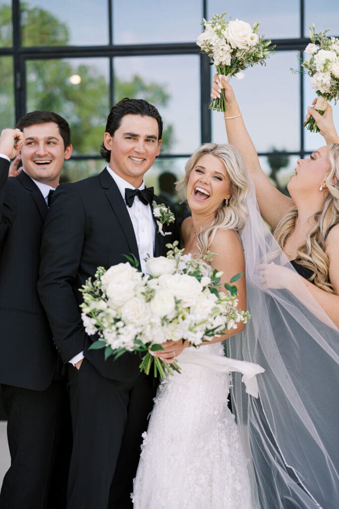 Candid laughter during wedding party photos at Dos Palomas Ranch