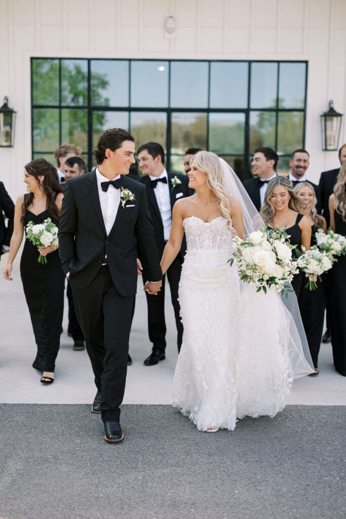 Candid laughter during wedding party photos at Dos Palomas Ranch