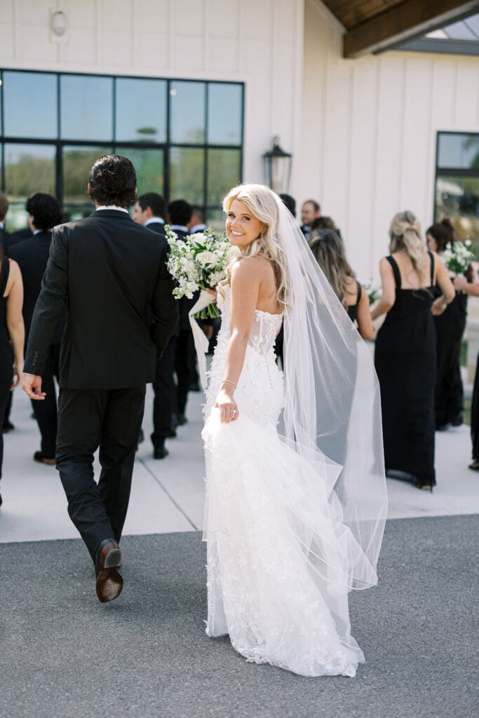 Candid laughter during wedding party photos at Dos Palomas Ranch