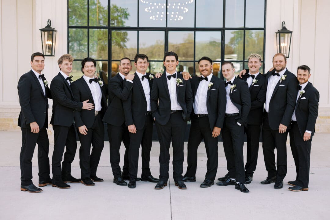 Candid laughter during wedding party photos at Dos Palomas Ranch