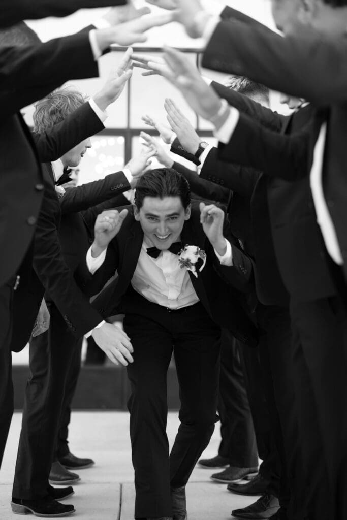 Candid laughter during wedding party photos at Dos Palomas Ranch