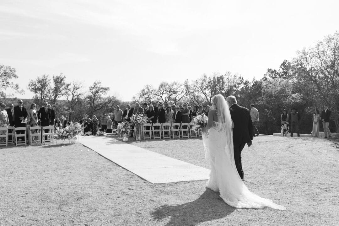 romantic ceremony with lush florals at Dos Palomas Ranch