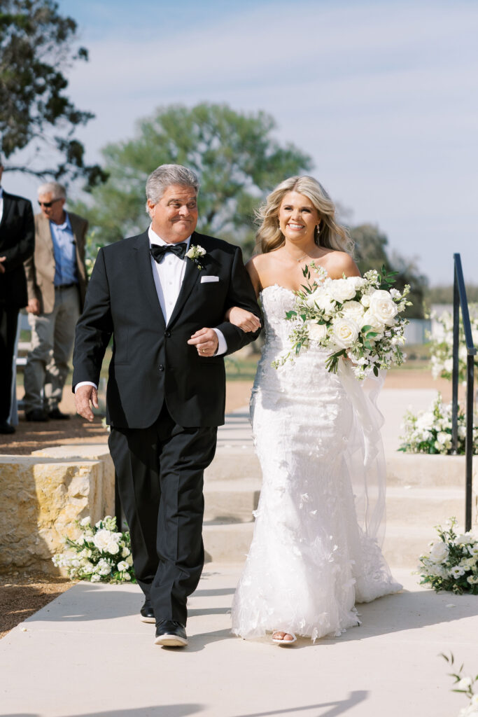 romantic ceremony with lush florals at Dos Palomas Ranch