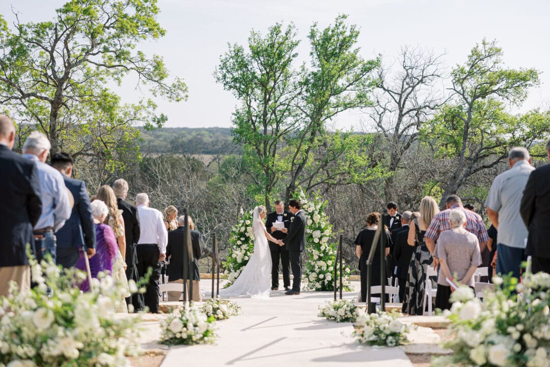 romantic ceremony with lush florals at Dos Palomas Ranch