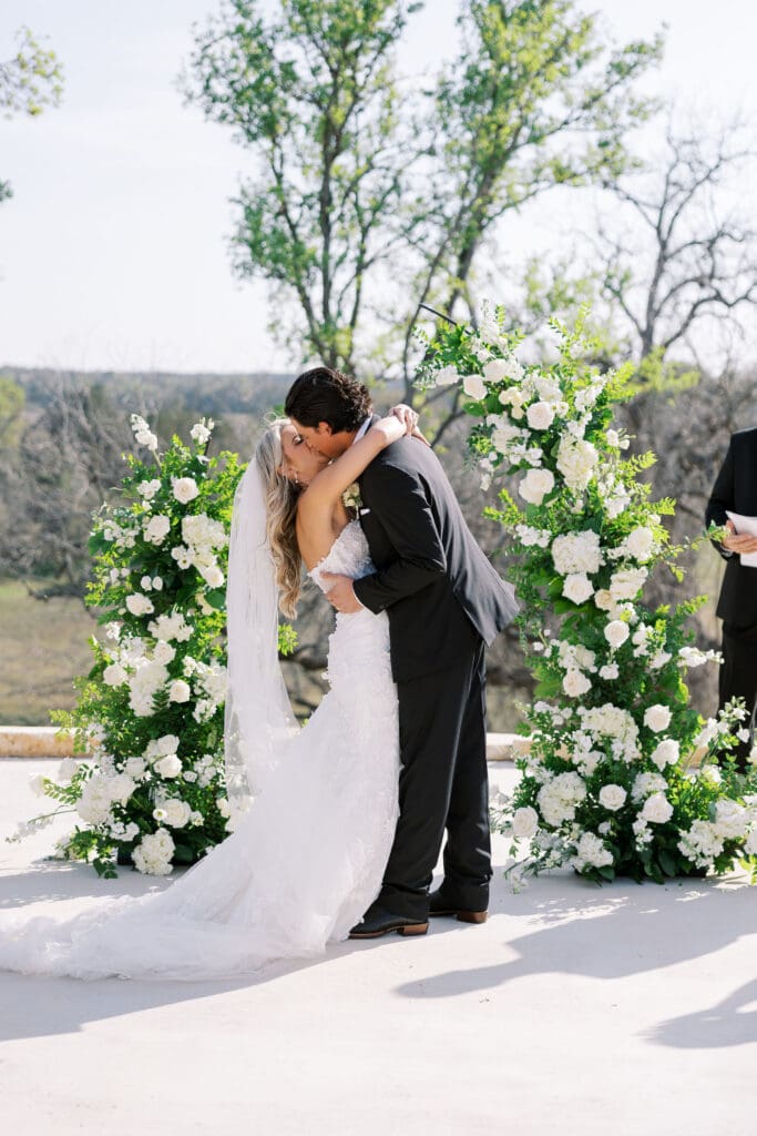 romantic ceremony with lush florals at Dos Palomas Ranch