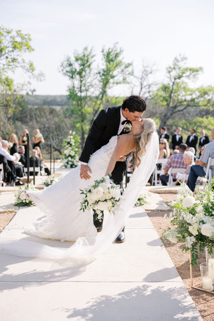 romantic ceremony with lush florals at Dos Palomas Ranch