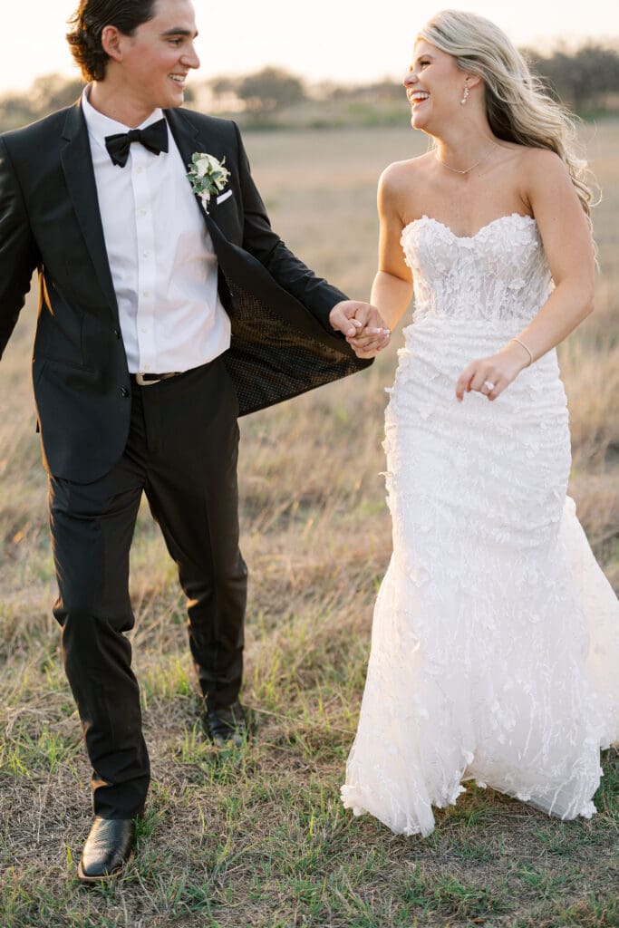 Bride and groom embracing at sunset at Dos Palomas Ranch wedding