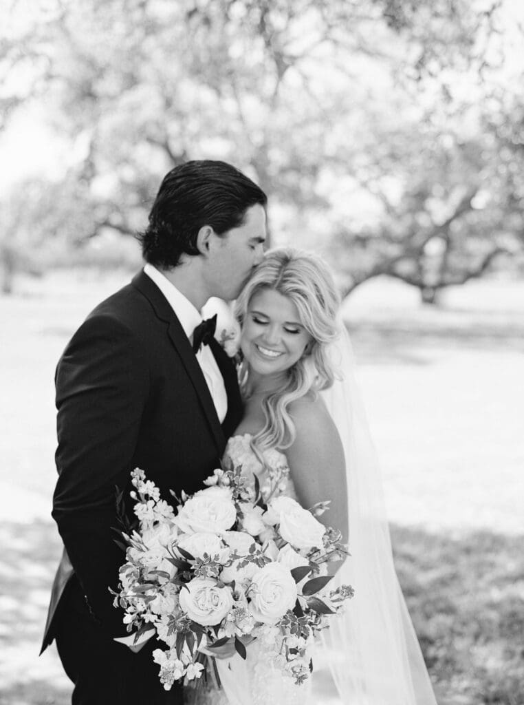 Candid laughter during bride and groom portraits at Dos Palomas Ranch
