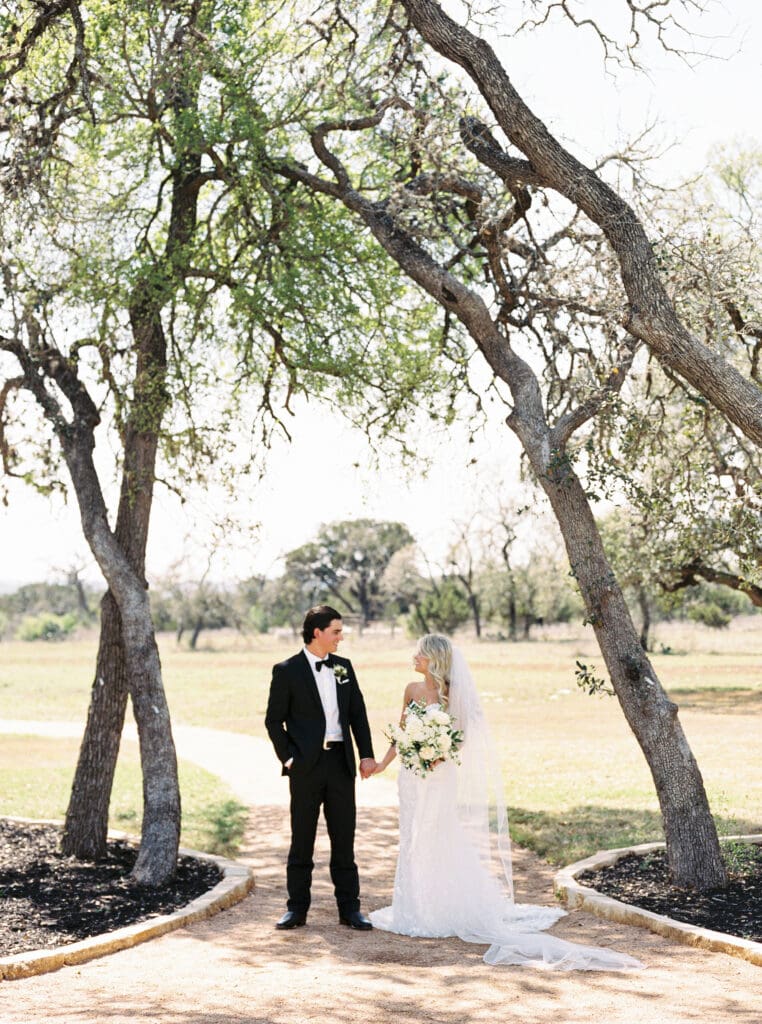 Candid laughter during bride and groom portraits at Dos Palomas Ranch