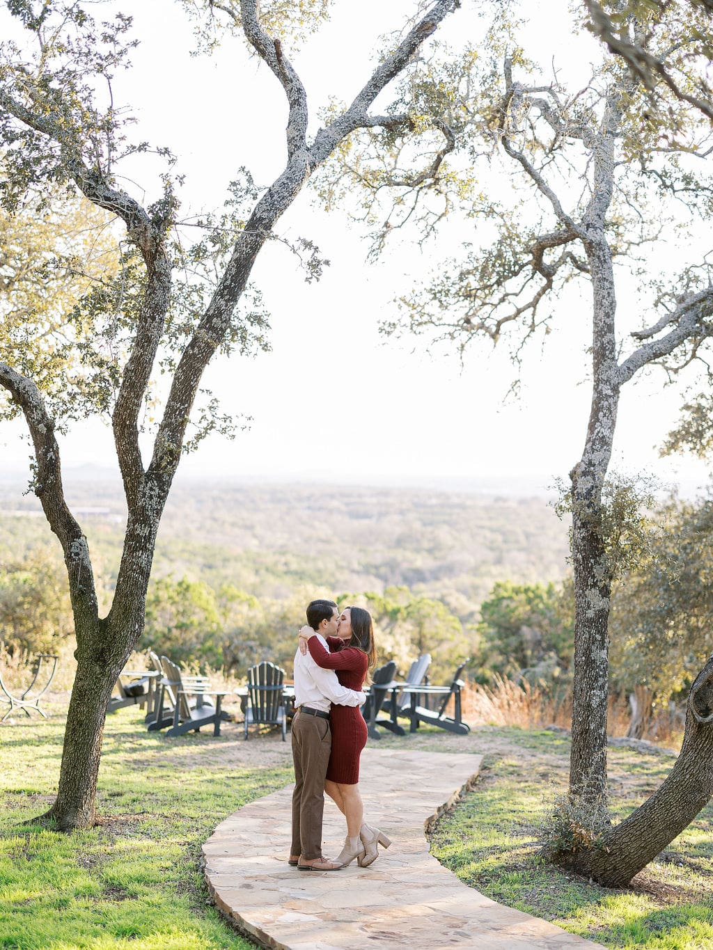 Couple embracing at family home during Wimberley engagement session