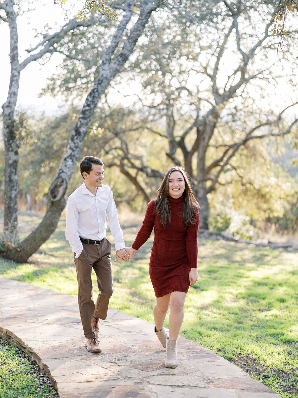 Couple embracing at family home during Wimberley engagement session