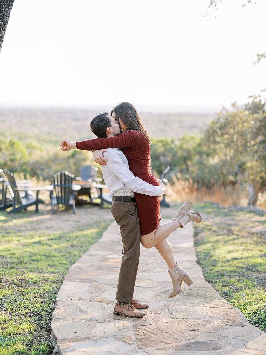 Couple embracing at family home during Wimberley engagement session