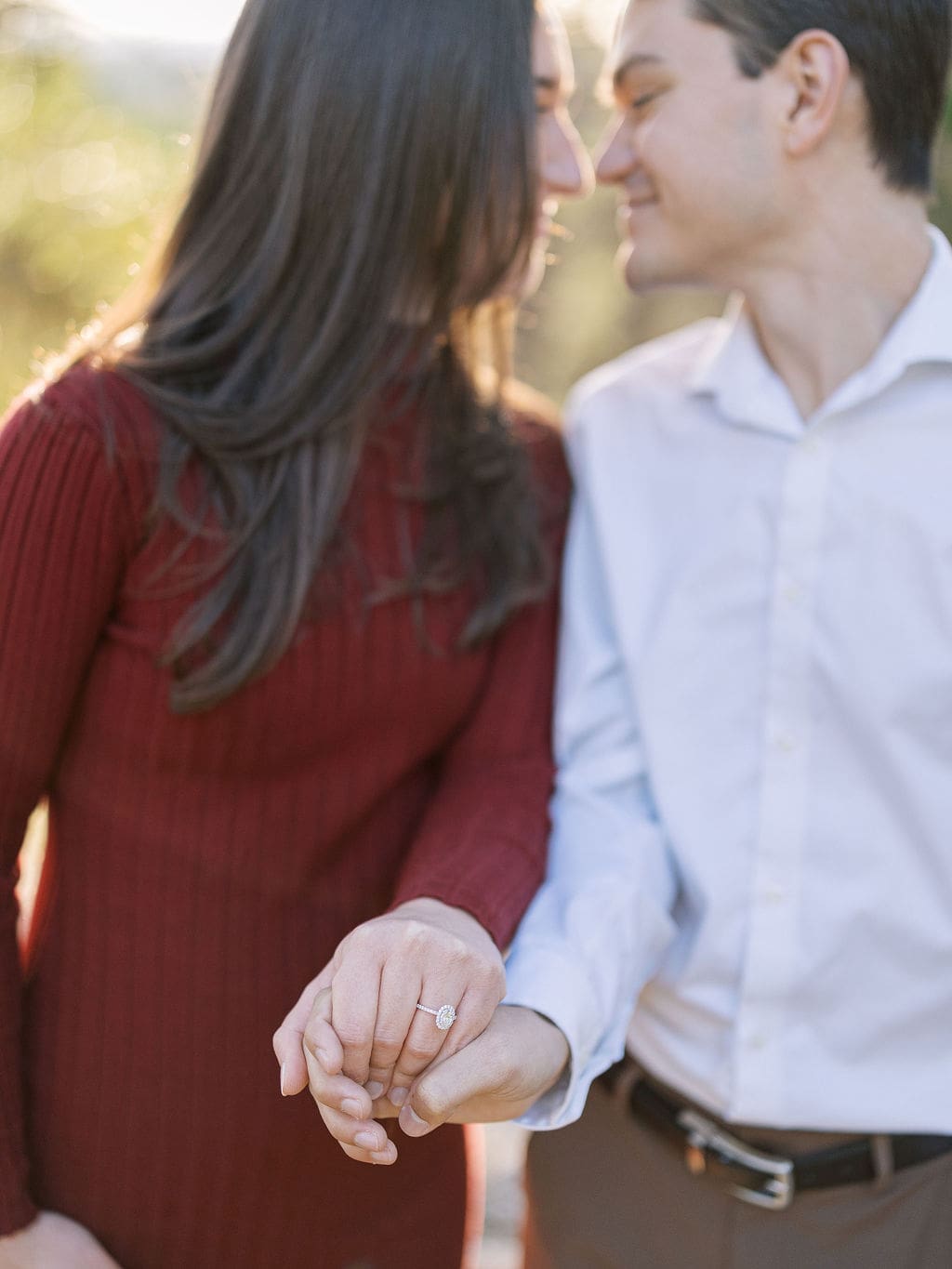 Couple embracing at family home during Wimberley engagement session