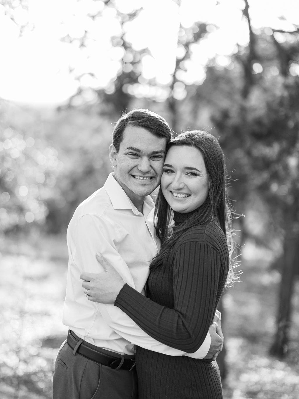 Couple embracing at family home during Wimberley engagement session