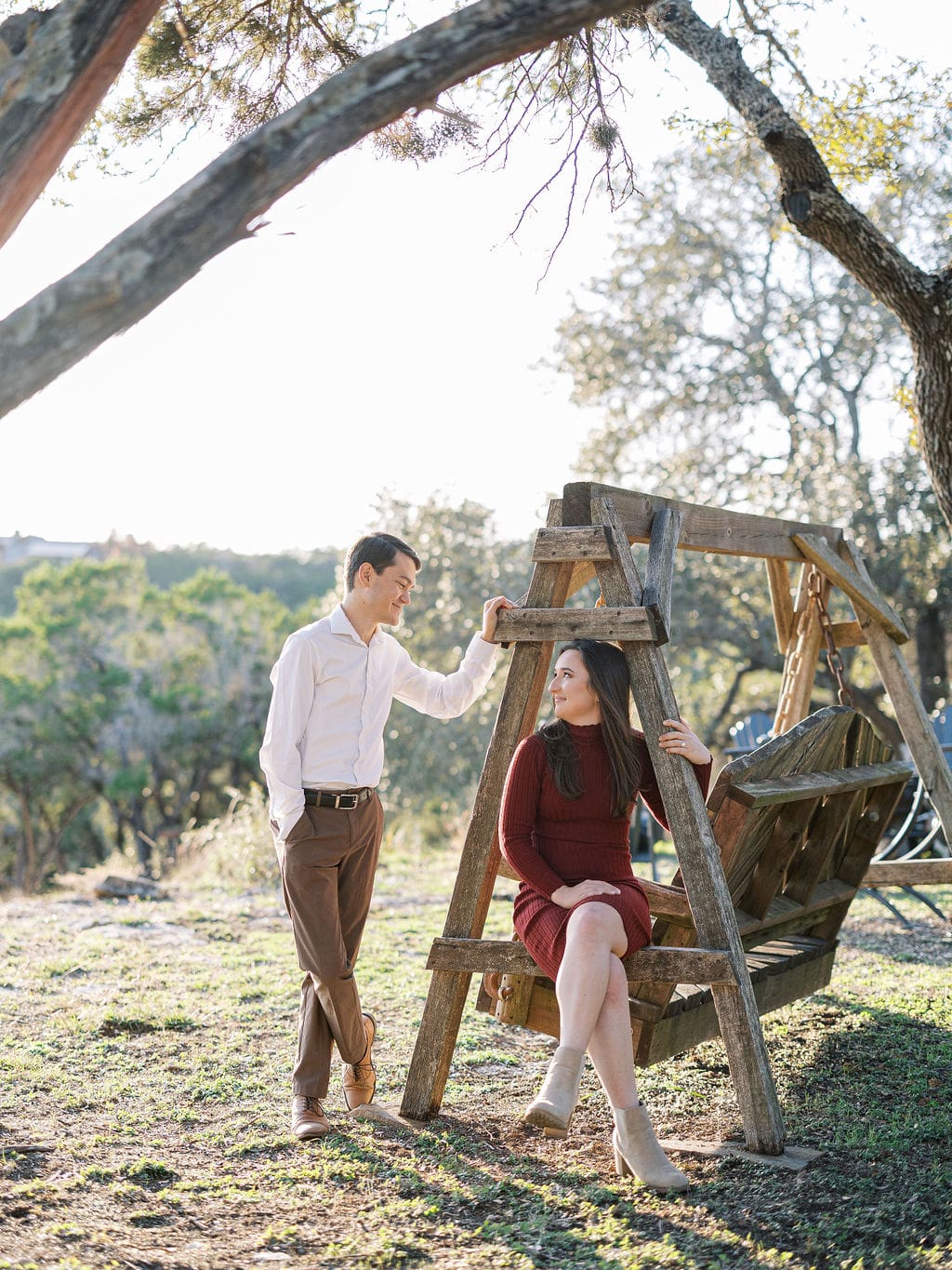 Couple embracing at family home during Wimberley engagement session