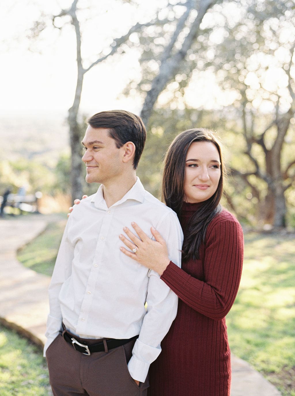 Couple laughing during engagement session at Wimberley winter home