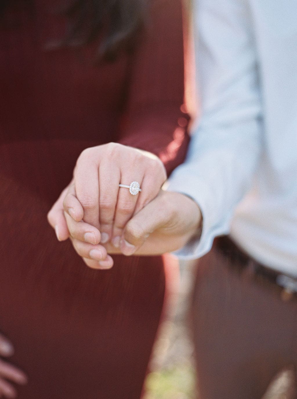 Couple laughing during engagement session at Wimberley winter home